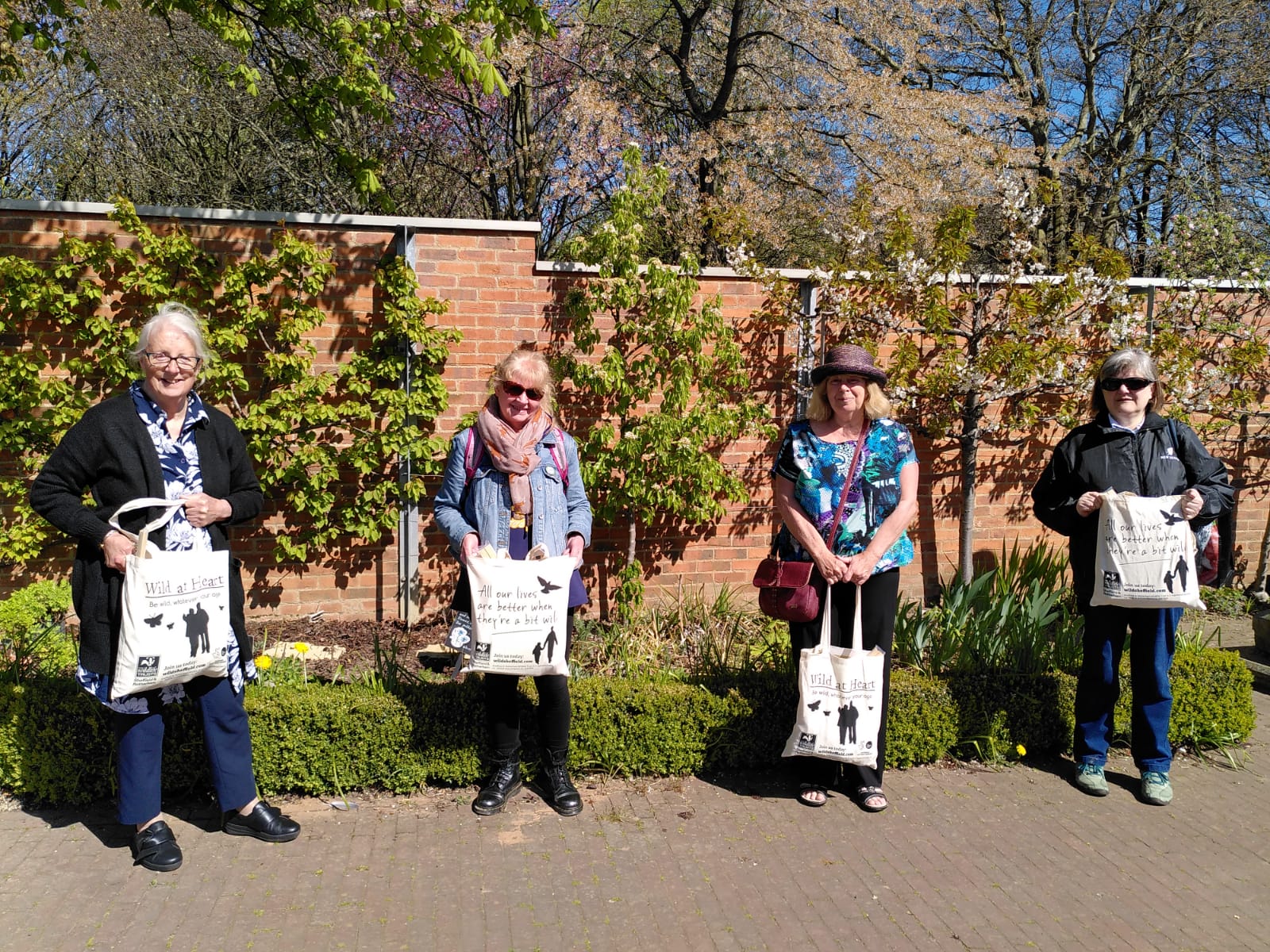 We know a strong connection to nature is good for our mental health; now a new study sets out to measure just how much it can help our wellbeing. Image shows Wild at Heart volunteers holding the nature activity bags which form part of the study.