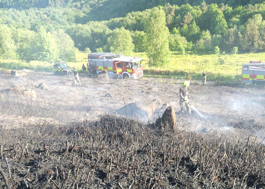 Fire engines responding to a wildfire near Agden Reservoir, spraying down peat. Photo: Sarah TW