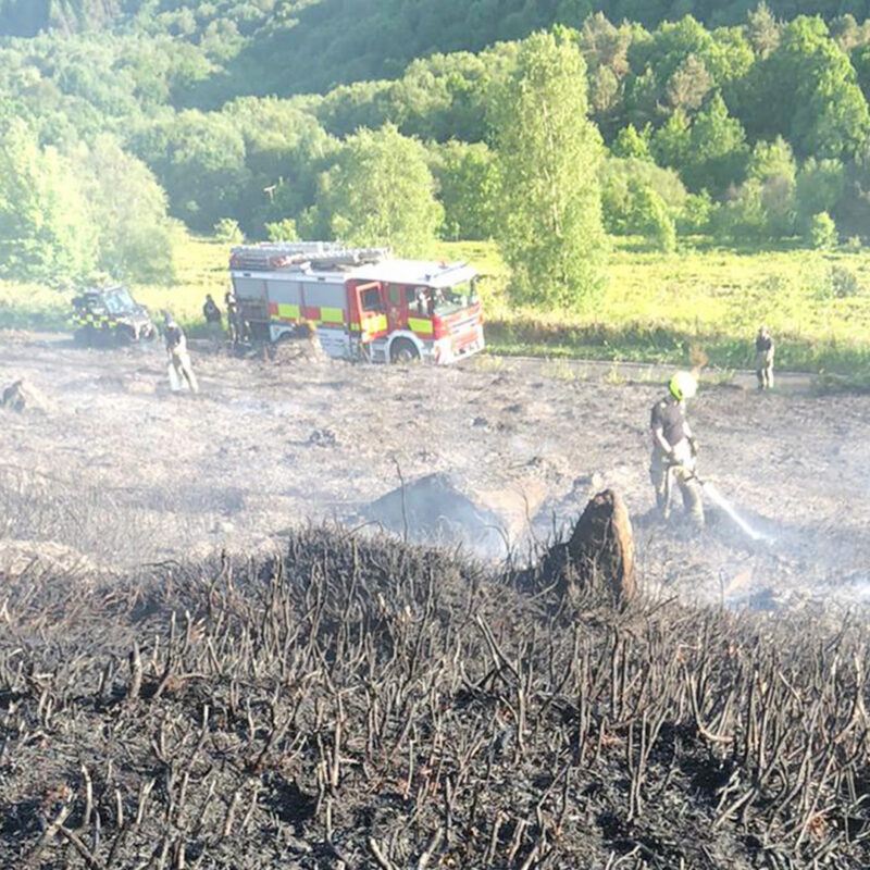Fire engines responding to a wildfire near Agden Reservoir, spraying down peat. Photo: Sarah TW