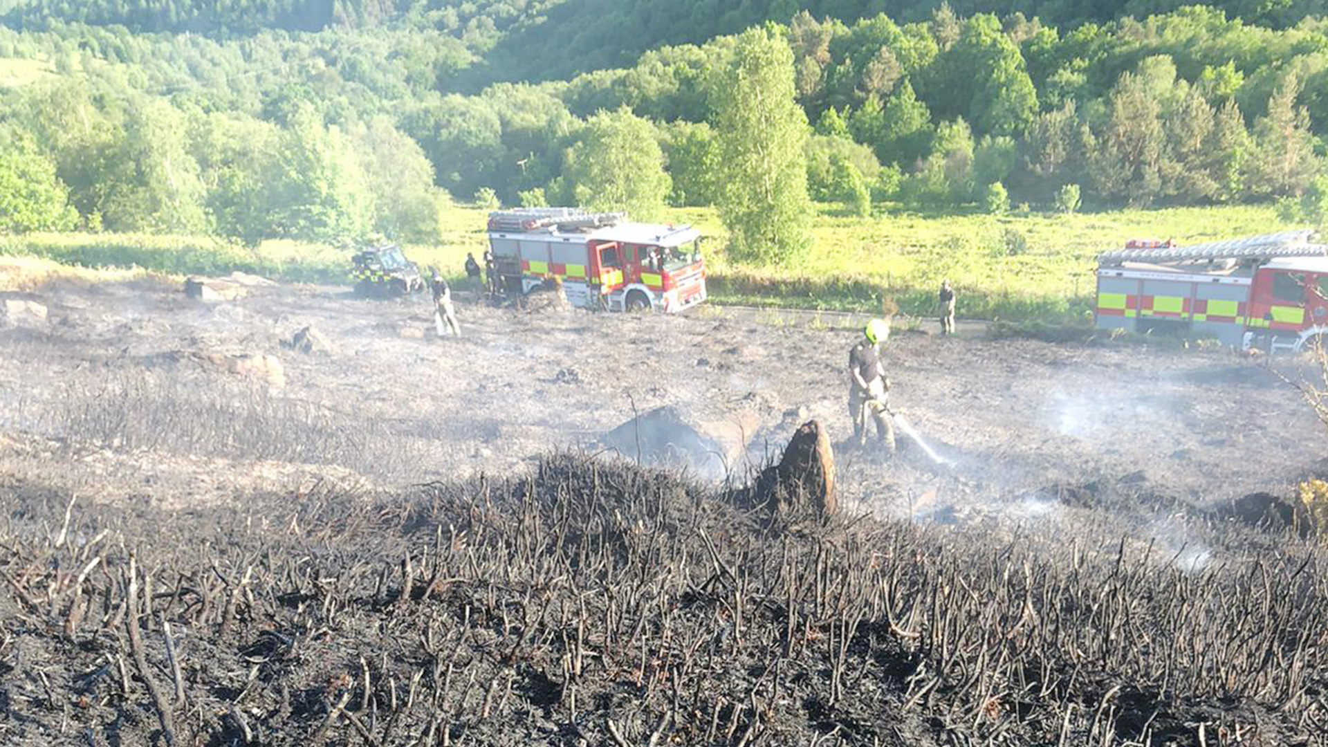 Fire engines responding to a wildfire near Agden Reservoir, spraying down peat. Photo: Sarah TW