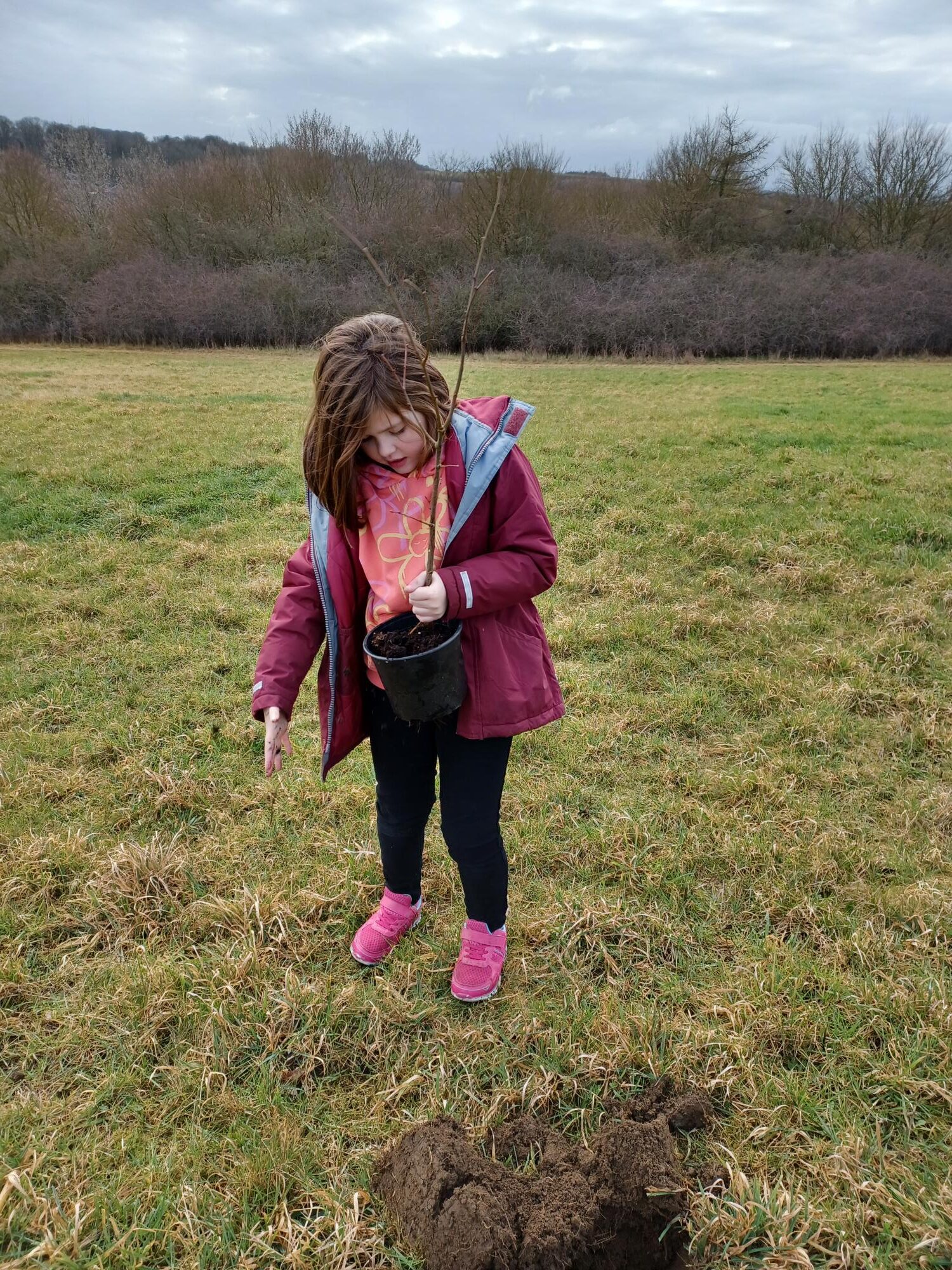 A child enjoying the community planting event on 25 February 2023 at Queen Elizabeth II Community Woodland in Dinnington, Rotherham
