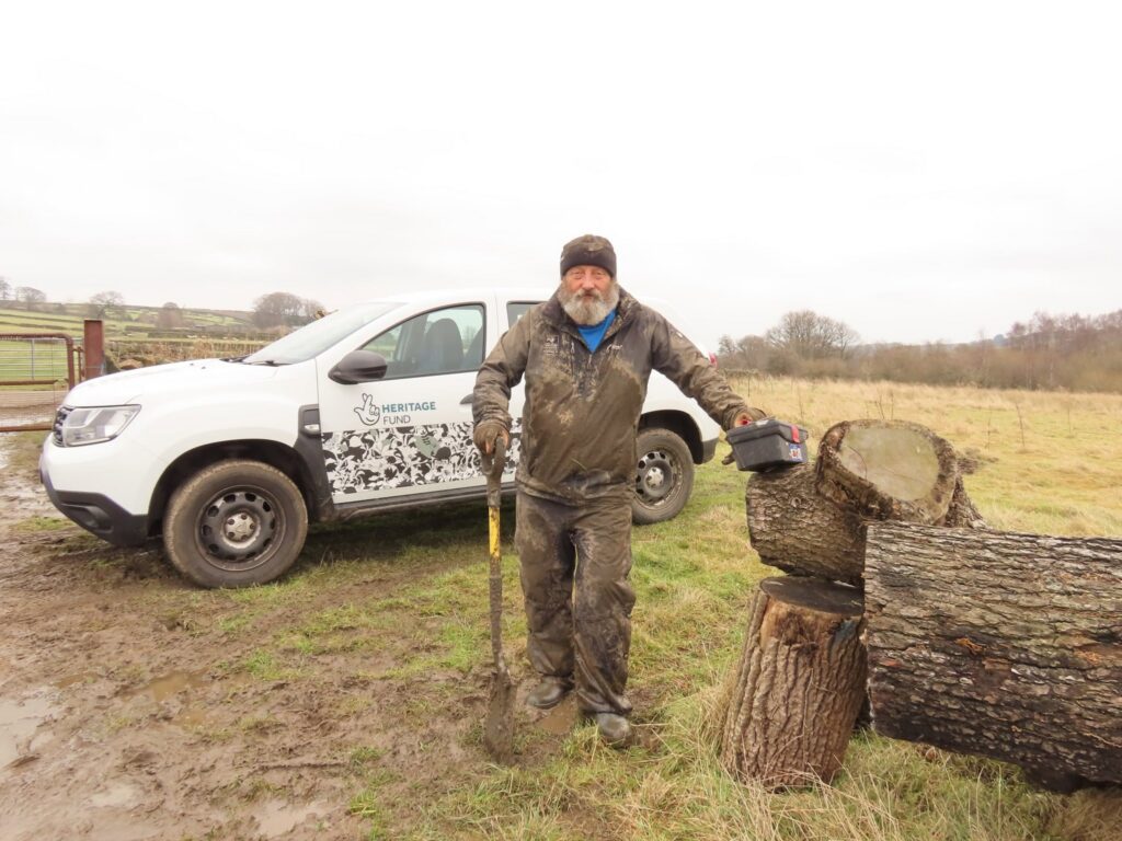 Keith Tomkins covered in mud ater a hard day taking out old fencing at Ughill Farm